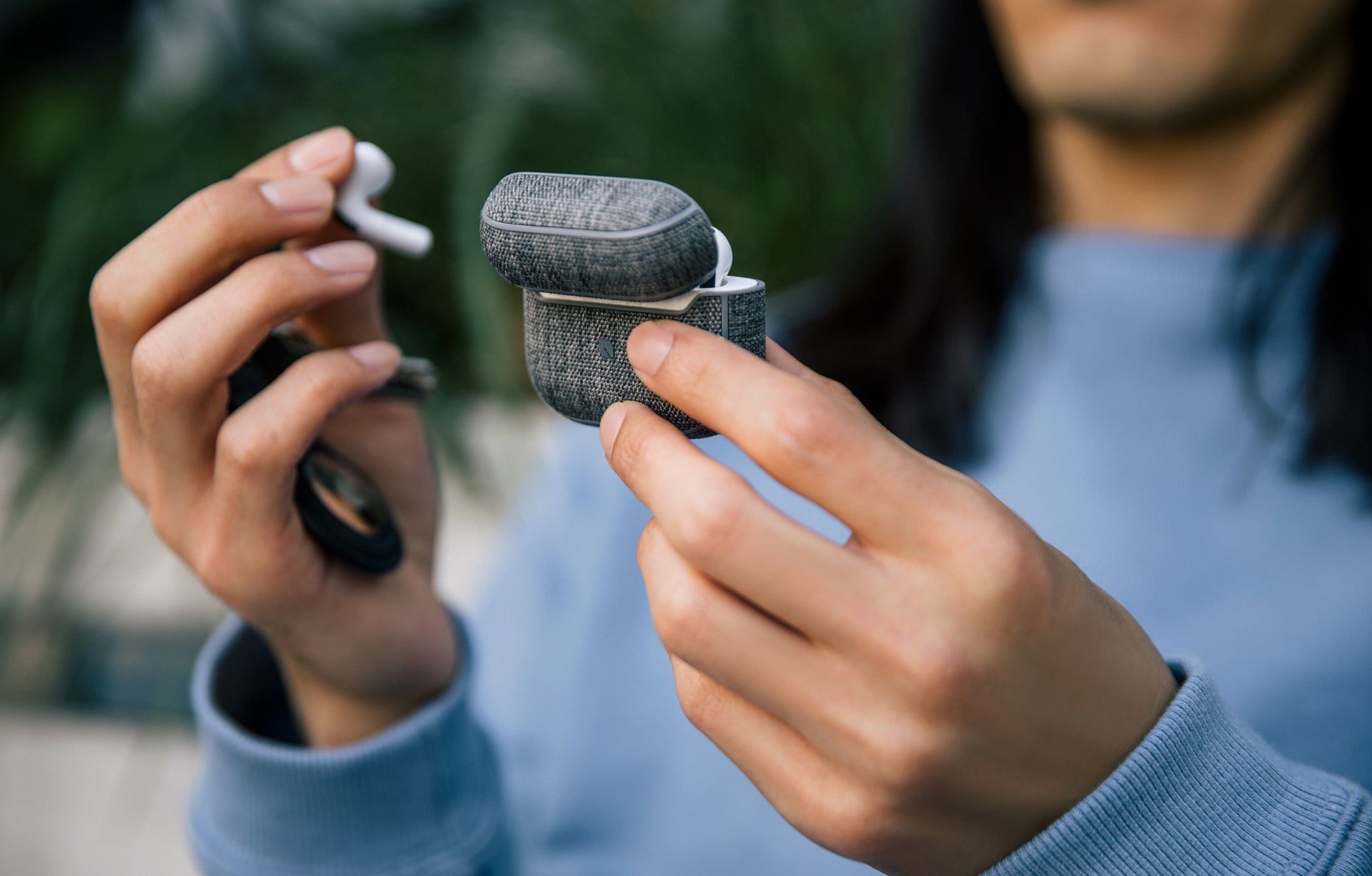 incase woolenex airpods pro case being held with the lid open