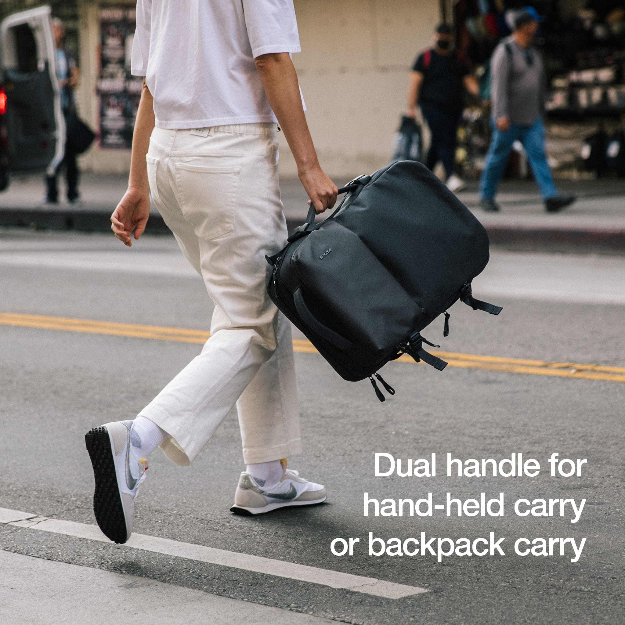 dual handle for hand-held carry or backpack carry