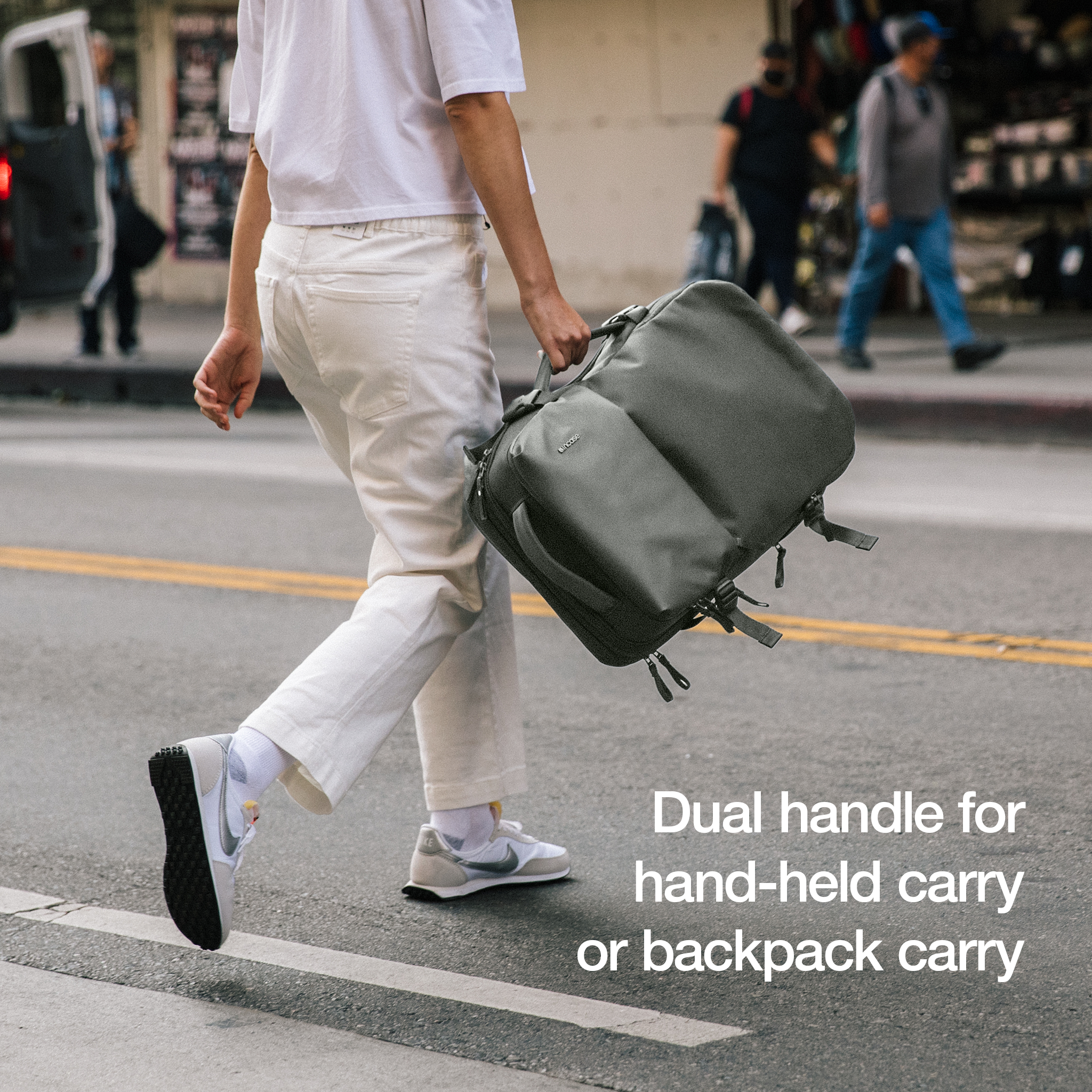 dual handle for hand-held carry or backpack carry