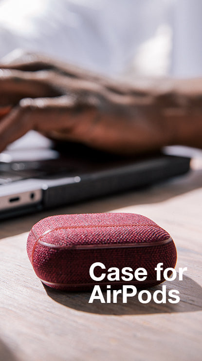 woolenex airpods case on table next to laptop