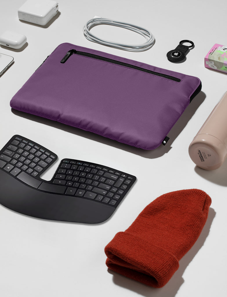 photo of black ergonomic keyboard and other travel accessories