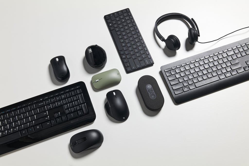 multiple Microsoft accessories laying flat in a group photo